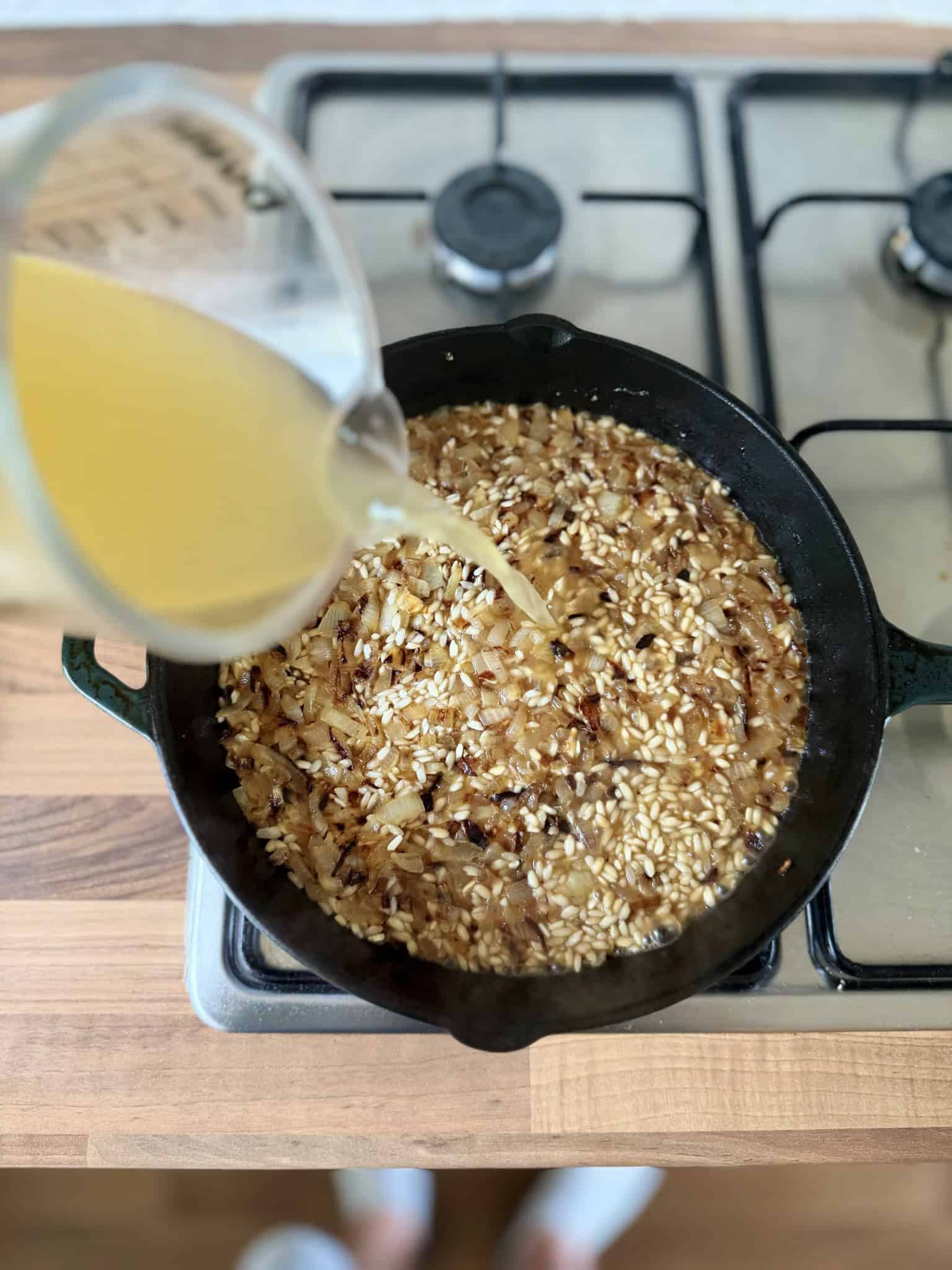 add stock to risotto